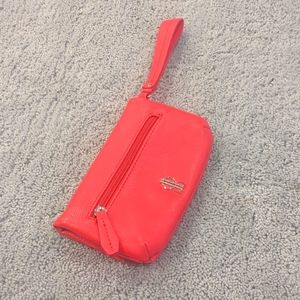 JLO Bright Coral Faux Leather Wristlet Clutch.